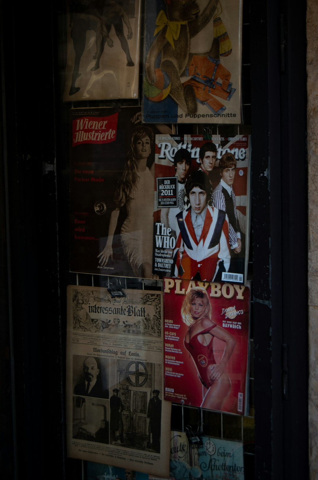 Editorial archive room filled with vintage advertising posters and print materials